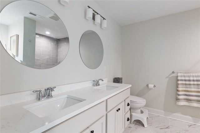 25 Kristin Dr, Cranston, RI 02921 - bathroom with marble look tile flooring and double vanity