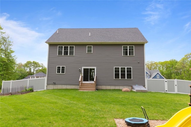 25 Kristin Dr, Cranston, RI 02921 - back of house featuring a fenced backyard, a fire pit, entry steps, and a gate