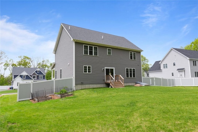 25 Kristin Dr, Cranston, RI 02921 - rear view of property featuring a vegetable garden