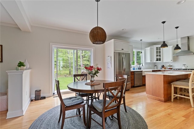 25 Kristin Dr, Cranston, RI 02921 - dining area featuring light wood-type flooring and crown molding