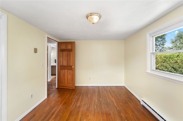 19 Cantara St, West Warwick, RI 02893 - spare room with baseboard heating and hardwood / wood-style floors