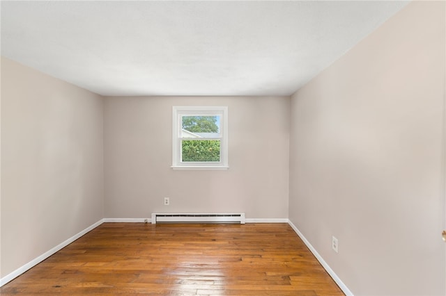 19 Cantara St, West Warwick, RI 02893 - empty room featuring a baseboard radiator and hardwood / wood-style floors