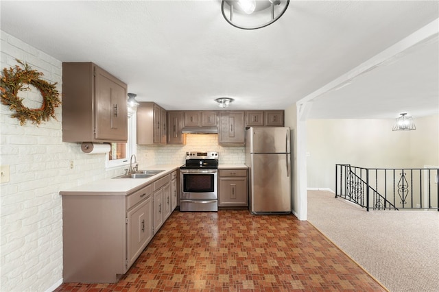 19 Cantara St, West Warwick, RI 02893 - kitchen featuring stainless steel appliances, light countertops, under cabinet range hood, backsplash, and open floor plan