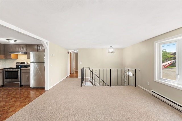 19 Cantara St, West Warwick, RI 02893 - kitchen featuring stainless steel appliances, a baseboard heating unit, under cabinet range hood, backsplash, and dark carpet