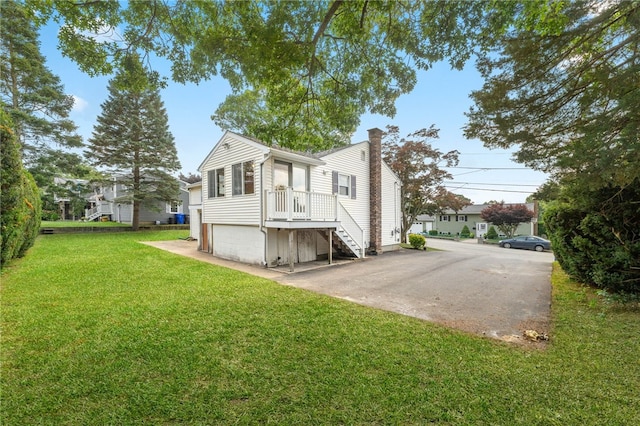 19 Cantara St, West Warwick, RI 02893 - view of side of property with a chimney, a yard, and stairs
