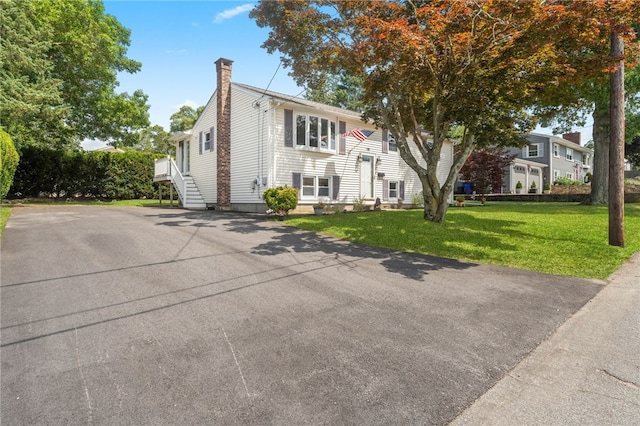 19 Cantara St, West Warwick, RI 02893 - raised ranch featuring a chimney and a front yard