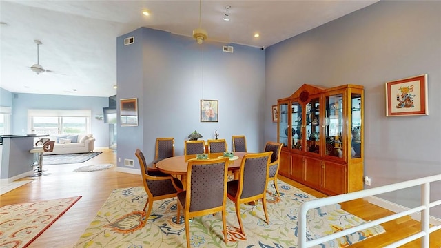 4090 Post Rd Unit B, Warwick, RI 02886 - dining area with light wood-style floors, a towering ceiling, and recessed lighting