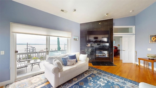 4090 Post Rd Unit B, Warwick, RI 02886 - living area with wood finished floors and a fireplace