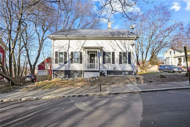40 Jenkins St, Providence, RI 02906 - view of front of home featuring a chimney