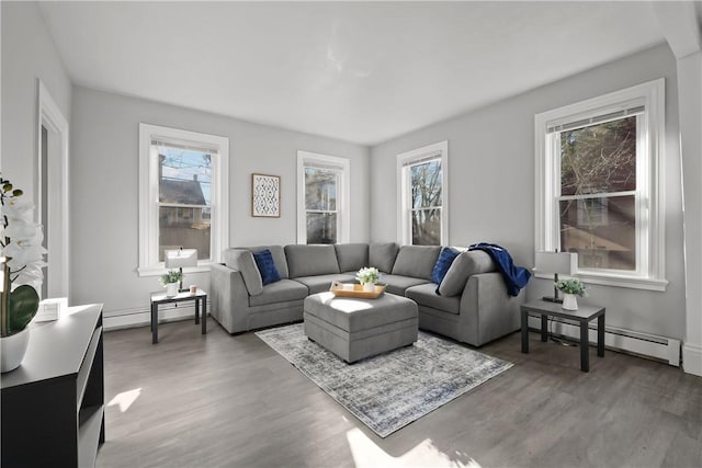 40 Jenkins St, Providence, RI 02906 - living room with wood finished floors, a baseboard heating unit, and plenty of natural light