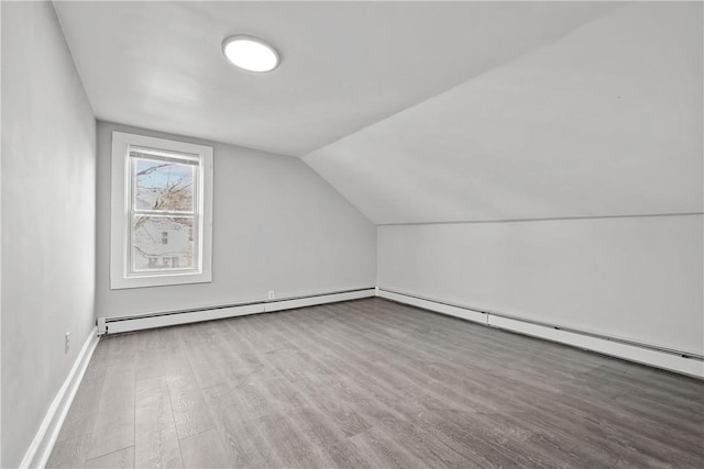 40 Jenkins St, Providence, RI 02906 - additional living space with baseboard heating, wood finished floors, and lofted ceiling