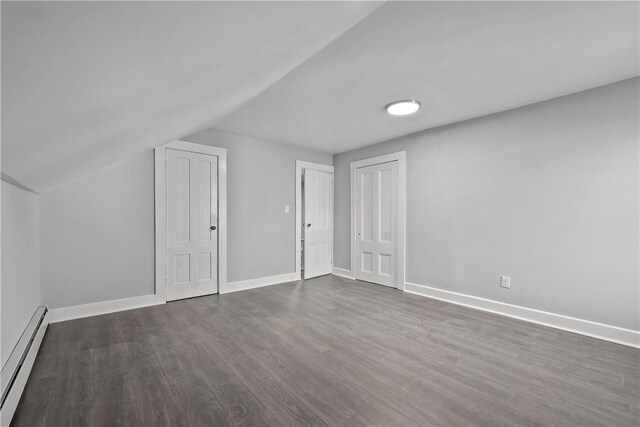 40 Jenkins St, Providence, RI 02906 - additional living space featuring a baseboard heating unit, dark wood-type flooring, and lofted ceiling