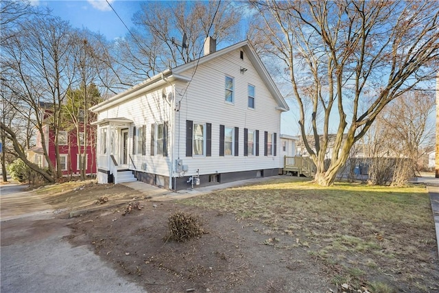 40 Jenkins St, Providence, RI 02906 - view of property exterior with a chimney