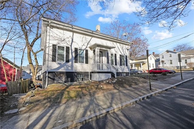 40 Jenkins St, Providence, RI 02906 - view of front of property featuring a residential view and a chimney