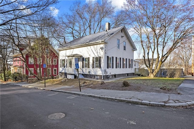 40 Jenkins St, Providence, RI 02906 - view of front of home featuring a chimney