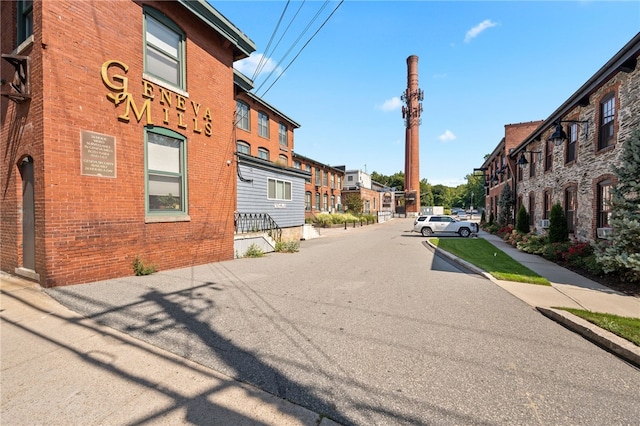 1117 Douglas Ave Unit 124, North Providence, RI 02904 - view of asphalt street featuring a residential view and sidewalks