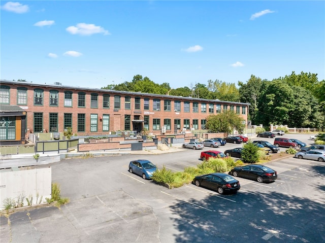 1117 Douglas Ave Unit 124, North Providence, RI 02904 - view of building exterior with uncovered parking