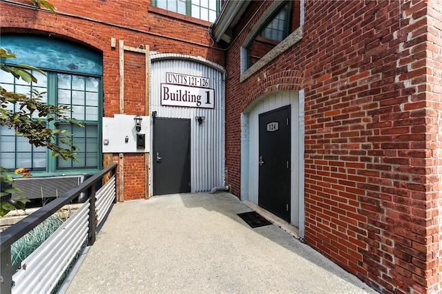 1117 Douglas Ave Unit 124, North Providence, RI 02904 - view of exterior entry featuring brick siding