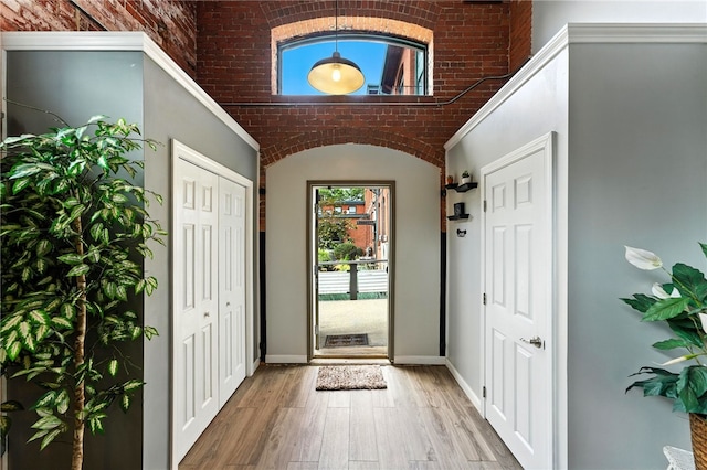 1117 Douglas Ave Unit 124, North Providence, RI 02904 - foyer entrance featuring wood finished floors and vaulted ceiling