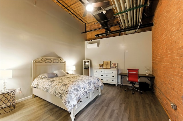 1117 Douglas Ave Unit 124, North Providence, RI 02904 - bedroom with a high ceiling, wood finished floors, and brick wall