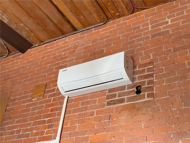 1117 Douglas Ave Unit 124, North Providence, RI 02904 - detailed view of a wall mounted AC and brick wall