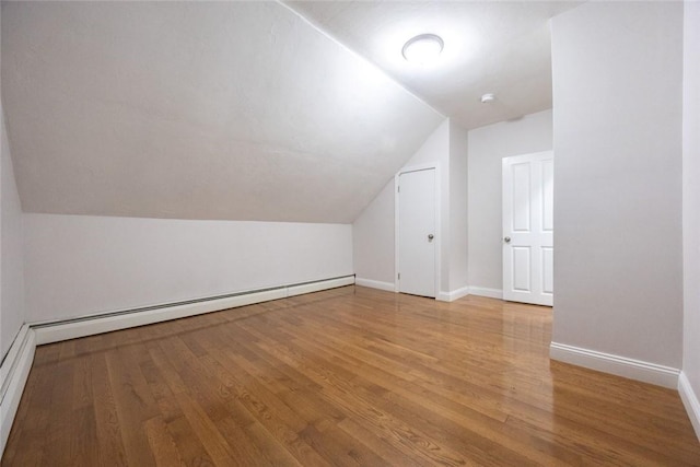 193 Howell St Unit 3, Providence, RI 02906 - additional living space featuring a baseboard heating unit, light wood-style floors, and vaulted ceiling