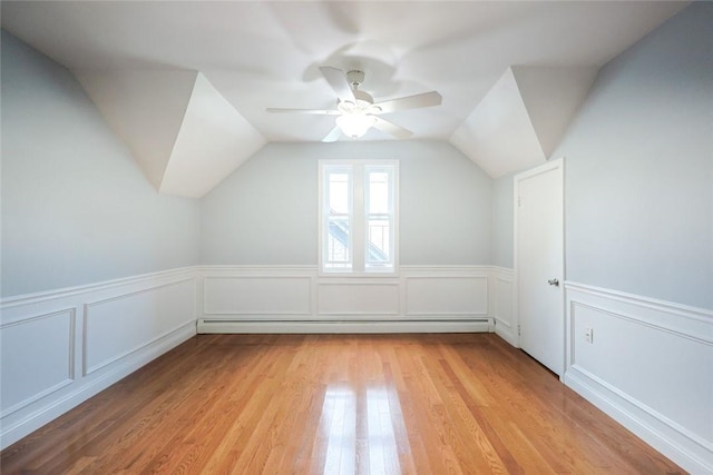 193 Howell St Unit 3, Providence, RI 02906 - bonus room with light wood-type flooring, a ceiling fan, wainscoting, vaulted ceiling, and a decorative wall