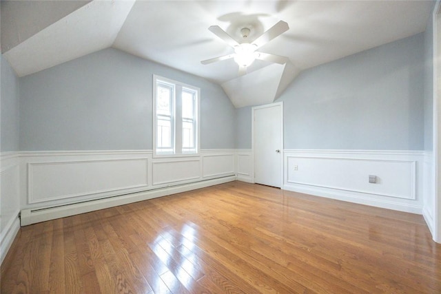 193 Howell St Unit 3, Providence, RI 02906 - bonus room featuring baseboard heating, lofted ceiling, wainscoting, wood finished floors, and a ceiling fan