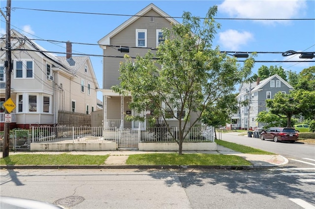 236 Vermont Ave, Providence, RI 02905 - view of front of property with covered porch and a fenced front yard