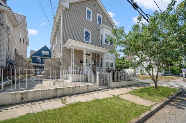 236 Vermont Ave, Providence, RI 02905 - multi unit property featuring covered porch and a fenced front yard