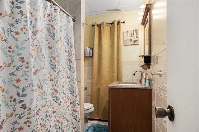 236 Vermont Ave, Providence, RI 02905 - bathroom featuring tile patterned floors, vanity, tile walls, and curtained shower