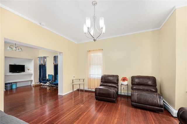 236 Vermont Ave, Providence, RI 02905 - living area featuring a chandelier, baseboard heating, wood finished floors, and ornamental molding