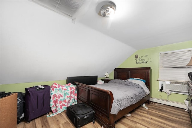 236 Vermont Ave, Providence, RI 02905 - bedroom with a baseboard radiator, lofted ceiling, wood finished floors, and cooling unit