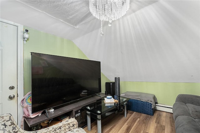 236 Vermont Ave, Providence, RI 02905 - living area featuring a baseboard heating unit, wood finished floors, and lofted ceiling