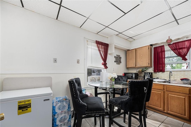 236 Vermont Ave, Providence, RI 02905 - dining area featuring light tile patterned floors and a paneled ceiling