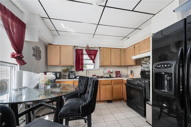 236 Vermont Ave, Providence, RI 02905 - kitchen featuring black appliances, a drop ceiling, light tile patterned floors, backsplash, and light countertops