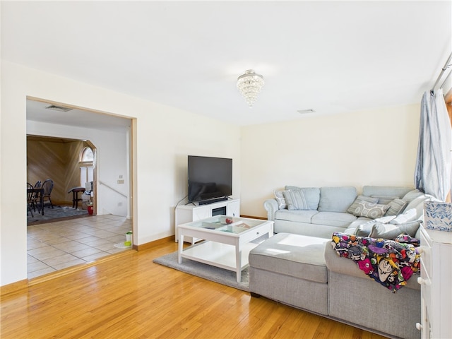 128 Arbor Ter, Tiverton, RI 02878 - living room featuring wood finished floors and a chandelier
