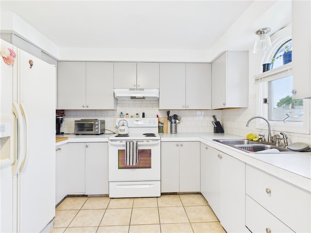 128 Arbor Ter, Tiverton, RI 02878 - kitchen with white appliances, under cabinet range hood, light countertops, backsplash, and light tile patterned floors