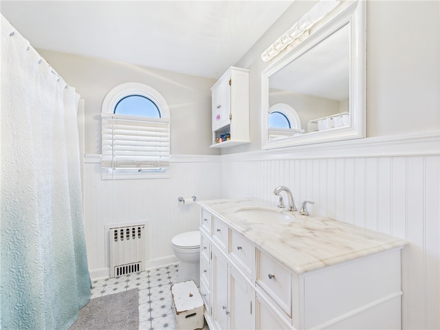 128 Arbor Ter, Tiverton, RI 02878 - full bathroom featuring radiator heating unit, a wainscoted wall, vanity, and tile patterned floors
