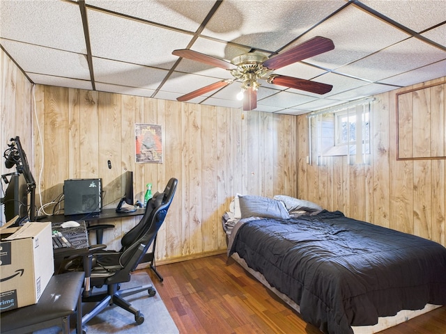 128 Arbor Ter, Tiverton, RI 02878 - bedroom with wood finished floors, a paneled ceiling, wooden walls, an office area, and ceiling fan