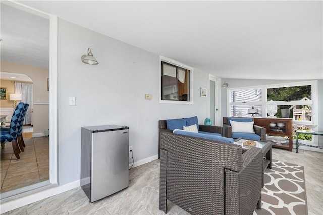57 Hillside Rd, Lincoln, RI 02865 - living room featuring arched walkways and baseboards