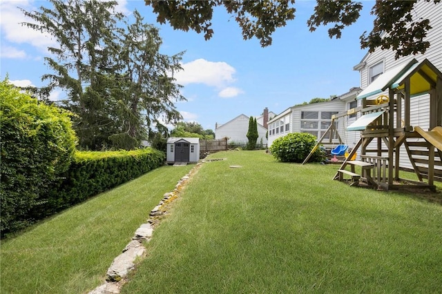 57 Hillside Rd, Lincoln, RI 02865 - view of yard featuring a storage unit and a playground