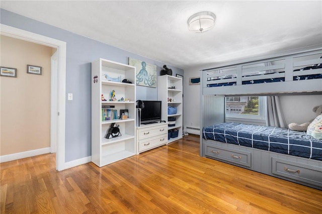 57 Hillside Rd, Lincoln, RI 02865 - bedroom with baseboard heating and light wood-type flooring