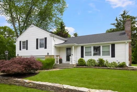 57 Hillside Rd, Lincoln, RI 02865 - split level home featuring a chimney and a front lawn