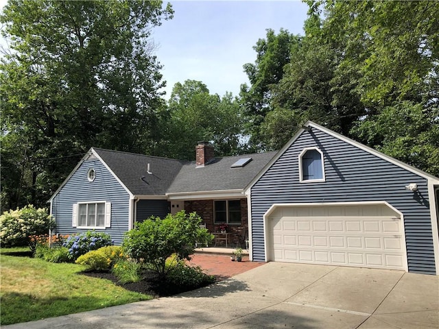 2 Marywood Ln, Cumberland, RI 02864 - view of front of house featuring a chimney, driveway, roof with shingles, and a garage