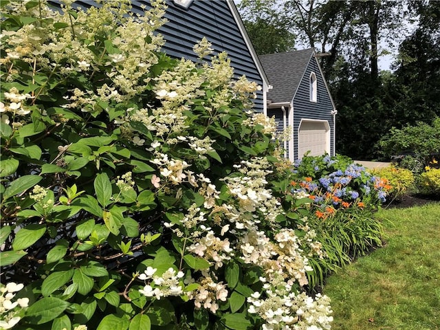 2 Marywood Ln, Cumberland, RI 02864 - view of property exterior featuring a garage and a shingled roof