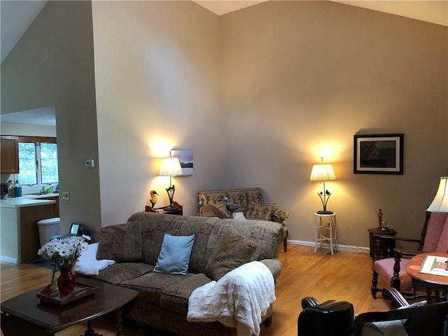2 Marywood Ln, Cumberland, RI 02864 - living room with high vaulted ceiling and light wood-type flooring
