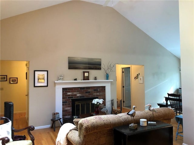 2 Marywood Ln, Cumberland, RI 02864 - living room featuring high vaulted ceiling, wood finished floors, and a fireplace