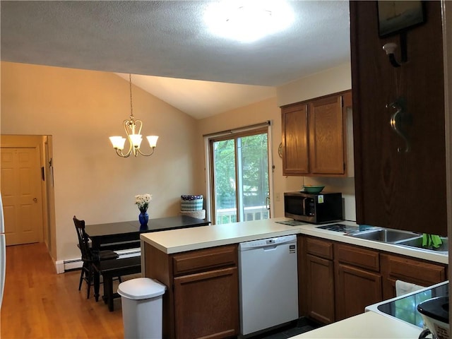 2 Marywood Ln, Cumberland, RI 02864 - kitchen featuring dishwasher, stainless steel microwave, a peninsula, vaulted ceiling, and a baseboard radiator