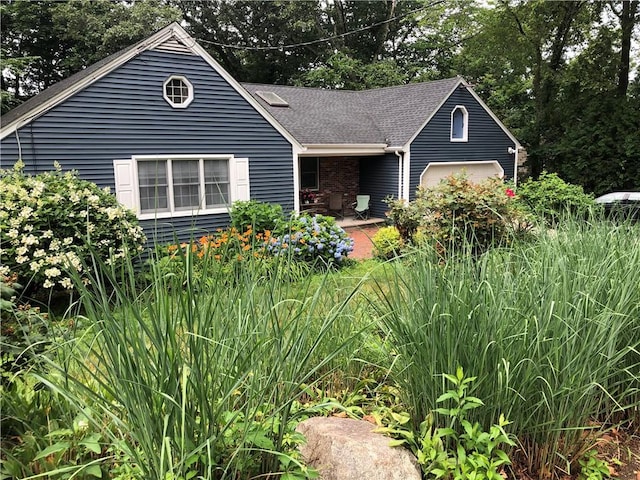2 Marywood Ln, Cumberland, RI 02864 - view of front of house featuring a shingled roof